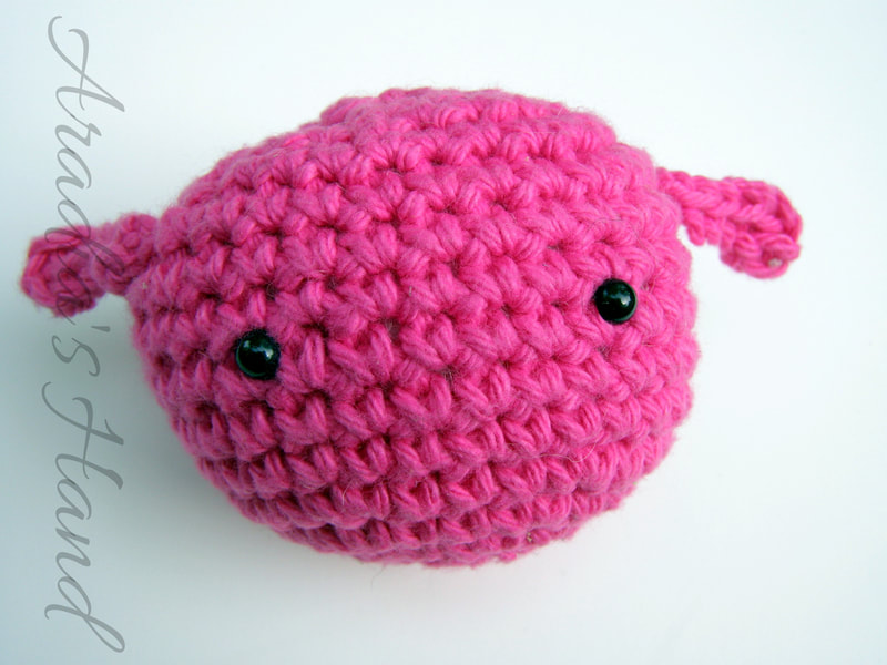 Pink crochet amigurumi alien doll