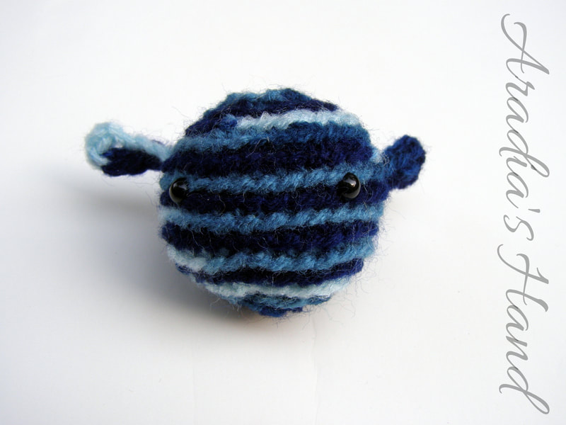 Blue crochet amigurumi alien doll