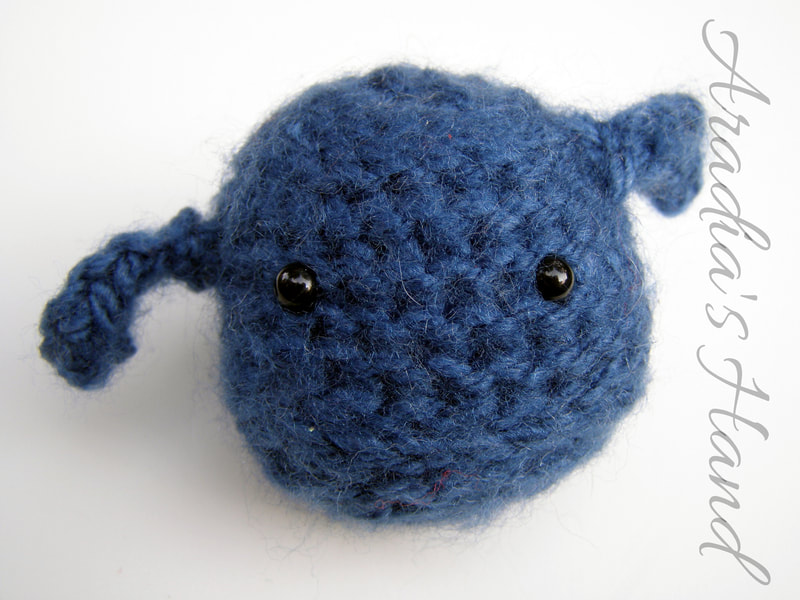 Fuzzy blue crochet amigurumi alien doll