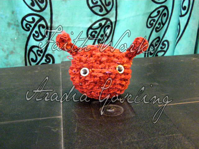 Fuzzy red crochet amigurumi alien doll